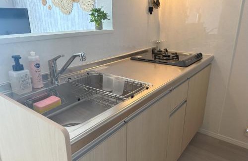 Kin Apartment | 新築!オーシャンフロント! ビーチ0分! 万座毛15分, JUNGLIA 40分, SOU Resort YAKA