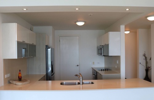 Playa Bonita Village Apartment | 08A Stunning Rooftop Pool, Views of Canal/Ocean