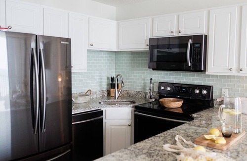 Wilmington Beach Condo | 0912 White Linen Room by Atlantic Towers