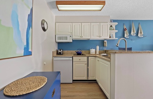 Charlevoix Condo | 1 Bedroom Condo with Waterfront Access | Pool, Hot Tub, Sauna | Patio