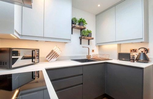 Cheltenham House | 1 Northall · One Bedroom Detached Home with Gated Parking