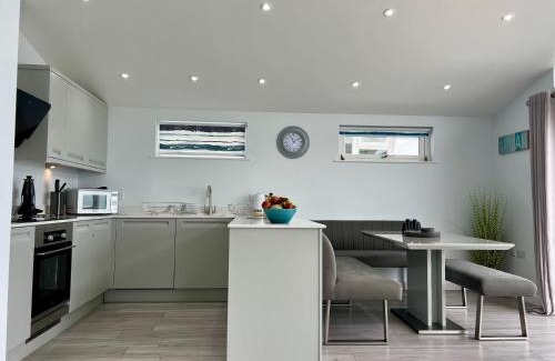 Westleigh House | 15 Golden Bay Holiday Village - Coastal Retreat with Breathtaking Views