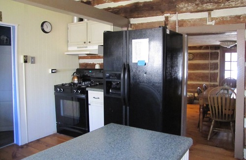 Hendersonville Cabin | 1800s Log Cabin with modern amenities conveniently located.