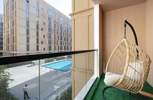 Sharjah Apartment | 1BHK Poolview Apartment With Balcony - Timber Retreat
