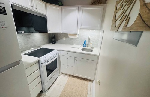 Emerald Isle House | 1BR beach getaway: pool, pier, sunset views. Full amenities. Near beach access.