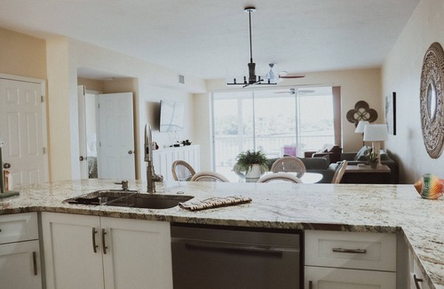 Vanderbilt Beach Condo | 1st Floor Condo Direct Bay/Gulf Beach Views! Steps To Beach!