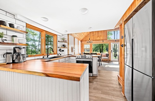 Hayward House | 2 cozy, secluded cabins on beautiful waterfront acreage with epic game roomn