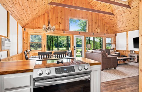 Hayward House | 2 cozy, secluded cabins on beautiful waterfront acreage with epic game roomn