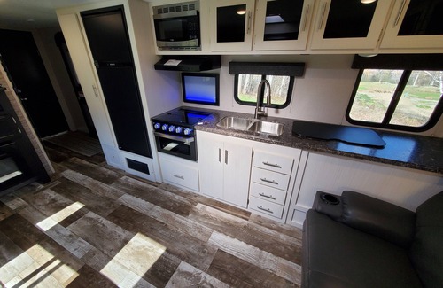 Eustis House | 27ft Nightly Rental RV in Sylvester Farm Campground and Cabins.