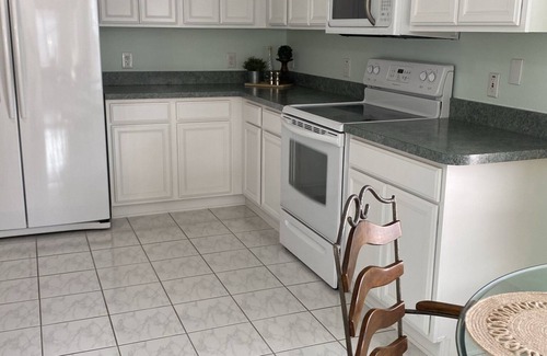 Belle Aire Villa | 3 bed 2 bath, 1500 sf, ct yard villa, private heated pool and 4 person golf cart