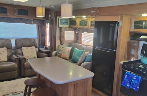 North Topsail Beach House | 35 ft RV, large deck, intercoastal sunset, campground across street from ocean