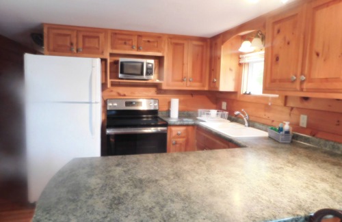Greenville Junction House | 3BR 1BA Pine Interior Home across the street from Moosehead Lake