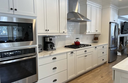 Greilickville House | 5 bed 3 bath - 10 beds - In town Traverse City with heated Pool on Cedar Lake!