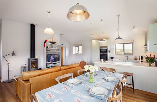 Bantham House | 5* cosy, dog-friendly holiday cottage with exceptional views of nearby beach