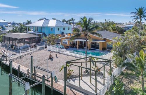 Mid Island House | 5535 Casa de Lujo- Heated Pool with Water Views home