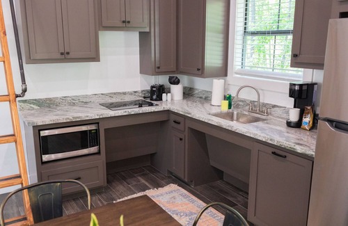 Livingston Cabin | A cozy little ADA accessible getaway right on Kickapoo Creek. Two Creeks Crossing Resort
