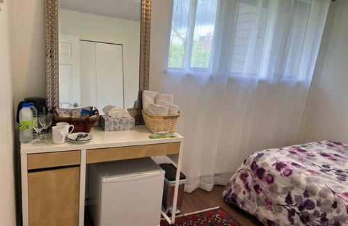 Central Lonsdale Bed & Breakfast | A cozy room, queen bed, 1/2 guest(s), free parking in the heart of Lonsdale Ave.