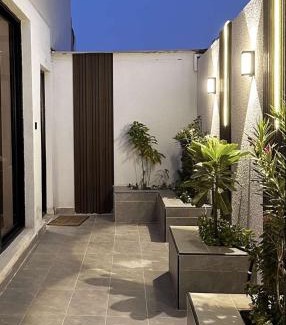 Al Hofuf Apartment | A cozy two-bedroom apartment with a living room and a patio that inspires relaxation