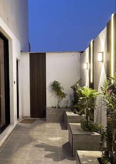 Al Hofuf Apartment | A cozy two-bedroom apartment with a living room and a patio that inspires relaxation