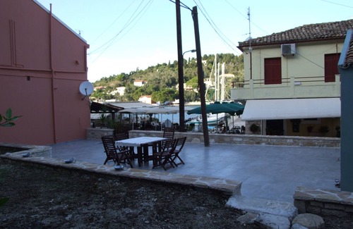 Lakka Villa | A Lovely beachfront stone house with a large yard and garden in Lakka Paxos.