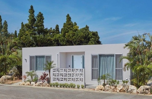 Karimata House | A luxurious inn with a coralcolored interiorEmer / Miyakojima Okinawa