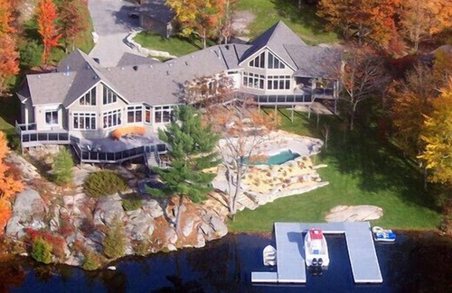 Georgian Bay House | A luxurious villa nestled along the bay upon a rock , breathtaking sunset views