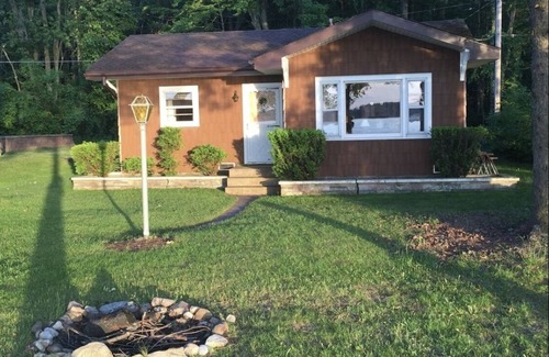Pentwater Cottage | A peaceful little lakefront house on the sunset side of Bass Lake!