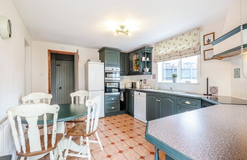 Saxthorpe Cottage | A spacious, bright property with a large inglenook fireplace and lovely furnishings.