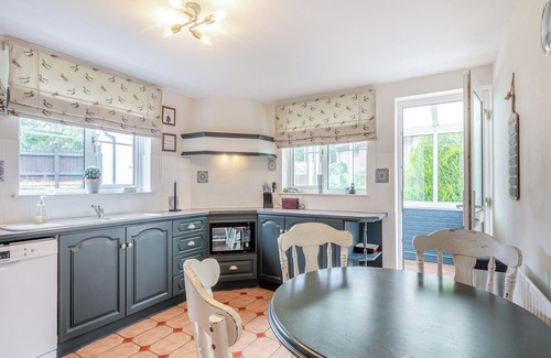Saxthorpe Cottage | A spacious, bright property with a large inglenook fireplace and lovely furnishings.