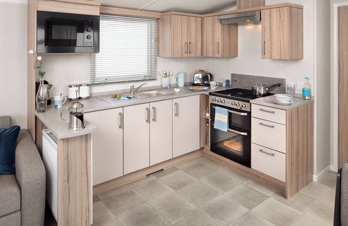 Cresswell House | A spacious open plan holiday home with one master double and two twin bedrooms.