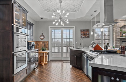 Forest Junction House | A warm & inviting modern retreat featuring on-site local brews & a home theater.