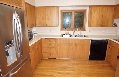 Urbandale House | Acreage InTown 4 BR, 2 Bath 3,300 sq ft half house option with gymnasium.