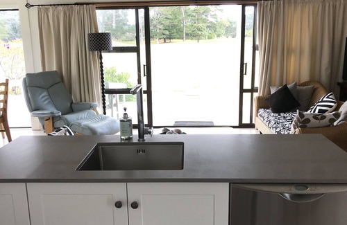 Pauanui House | Airfield property that has a beach vista, enjoy the sunny north-facing bbq area
