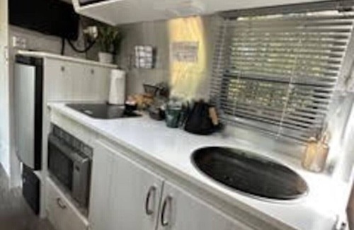 Eureka Springs RV Rental | Airstream Bambi with Hot Tub and outdoor kitchen