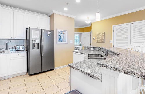 Sunset Island Condo | Amazing Family Condo w/AC, Private W/D, Shared Pool, Free WiFi, & Bay Views