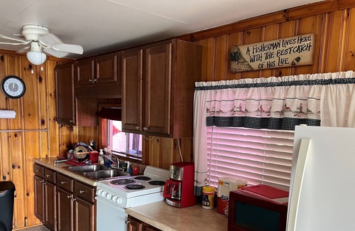 New Tazewell Boat Rental | Anchored Oasis Floating house on Norris Lake.