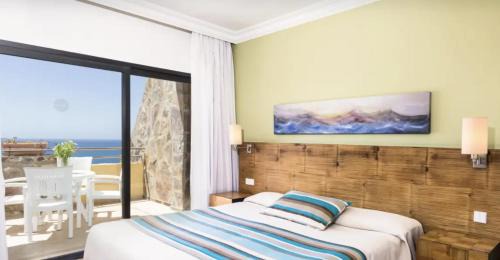 Tarajalillo Apartment | Apartamento 4 Estrellas con Vistas al Mar y Piscina en Bahía Feliz