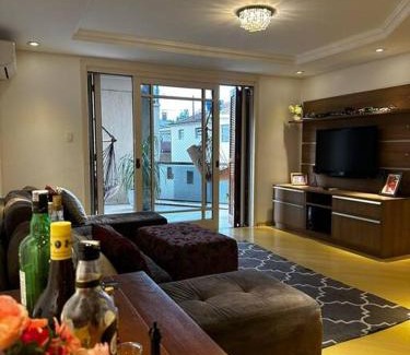 Borgo House | apartamento em bairro nobre suíte com ar condicionado e banheira com hidromassagem