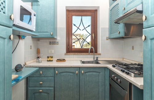 Porto Pollo Apartment | Apartment 'Casa Lauretta' with Sea View, Shared Pool and Air Conditioning