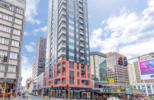 Auckland Central Business District Apartment | Apartment in Auckland City in Front of Sky Tower