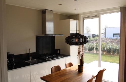 Lathum Ski Chalet | Apartment with Sauna and Terrace in Gelderland