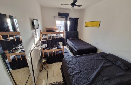 Pitangueiras Apartment | ApMar 15a até 8 pessoas - Pitangueiras Guarujá - 2 minutos da praia - 2 quartos e 1 suíte com Ar Condicionado - 1 Vaga Garagem 24h - Próximo de mercados, bares, restaurantes