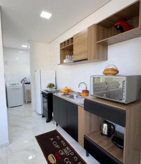 Piratuba Apartment | Apto Girassol - 2 Quartos, Apto moderno,confortável e de frente para avenida principal!