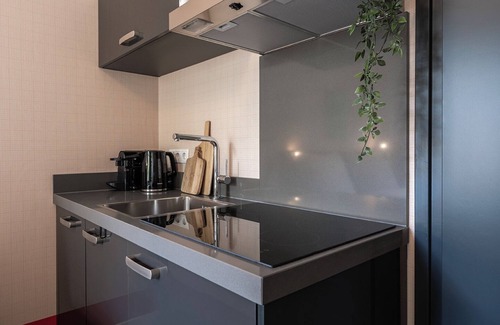 Centrum Apartment | Artist-inspired suite for 2 with king bed, private kitchen, air conditioning, and all modern comforts. Perfect for couples or solo travelers.