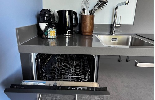 Centrum Apartment | Artist-inspired suite for 2 with king bed, private kitchen, air conditioning, and all modern comforts. Perfect for couples or solo travelers.