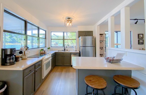 Cotter House | As close to the water as you can get! Updated and relaxing!