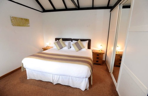 Runnymede Cabin | Ash lodge sleeps two people in a peaceful, private setting.