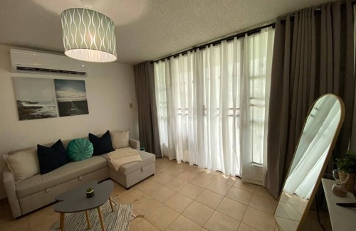 La Mela Condo | Bahia Real apartment located front of the pool