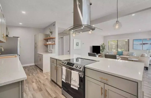 Bayshore Gardens House | Bayshore Gardens remodel with hot tub + fire pit + walk to park and marina