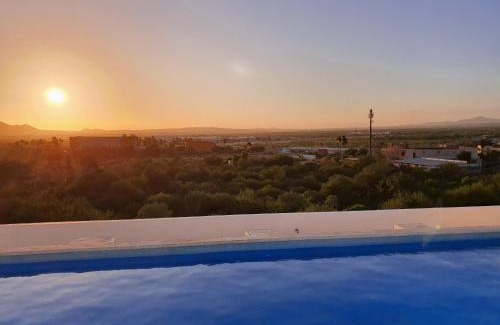 El Tezal Apartment | Beach Bliss Retreat, Renovated Condo with Rooftop Pool, Grill, and Game Night Vibes!